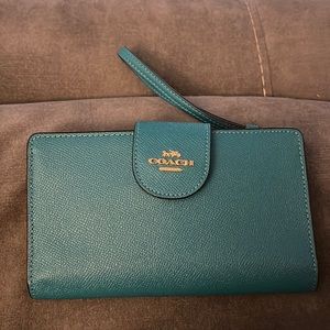 Teal coach wristlet